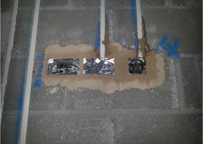 Air Tightness Testing & Thermal Imaging Dublin SOLUTION - Use of sand & cement to seal pouris conctete blocks behind electrical services