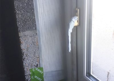 Air Tightness Testing & Thermal Imaging Westmeath SOLUTION - Installing air tightness tape around window